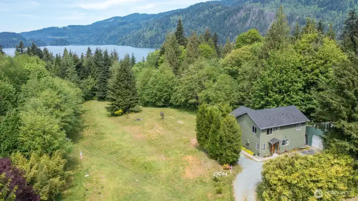 Home sits on 3 private acres with Lake Whatcom just below. Surrounding hills provide a great view along with a filtered winter view of the lake. Home sits on 3 private acres with Lake Whatcom just below. Surrounding hills provide a great view along with a filtered winter view of the lake.