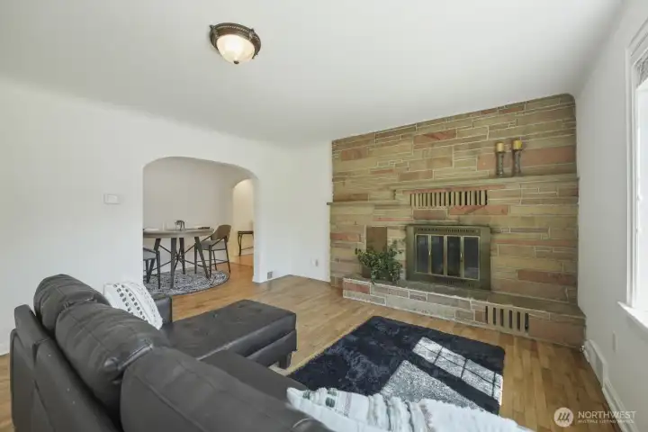 2nd living area could double as massive dining- offers wood burning fireplace with floor to ceiling sandstone style cultured stones