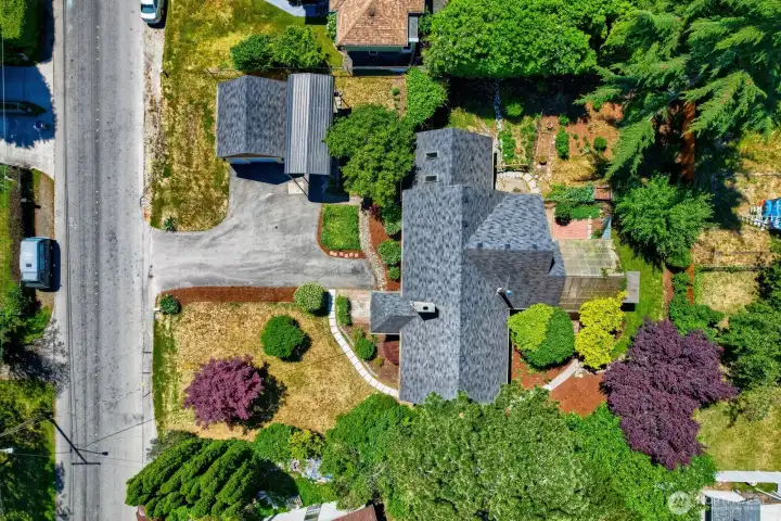 Well landscaped, oversized lot with fencing and many outdoor "rooms" to explore and enjoy!