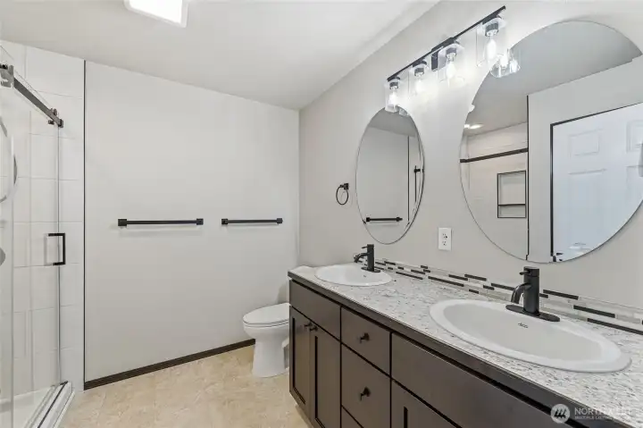 Primary bathroom with shower, double sinks