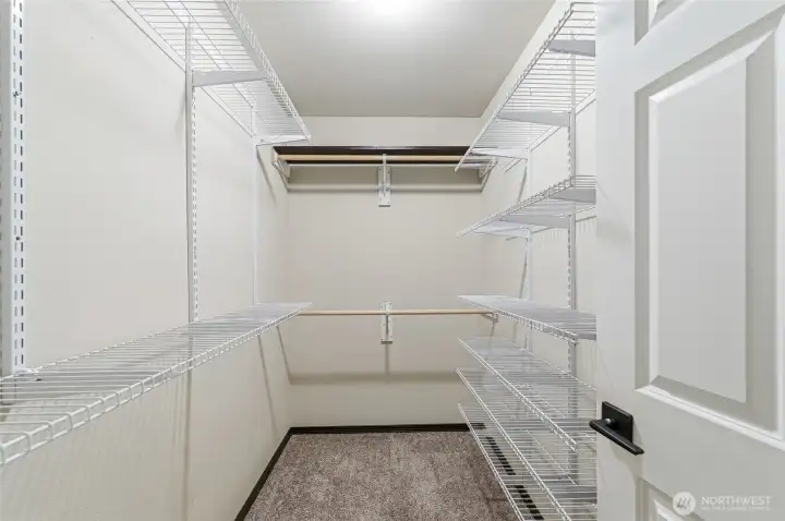 Walk-in closet in primary bedroom