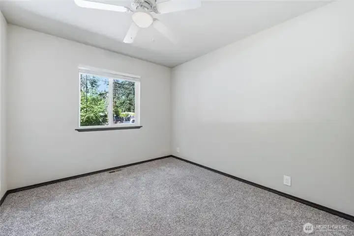 Bedroom 1, lots of natural light, closet with built-in shelves