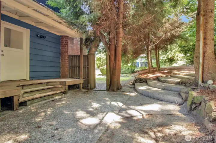 Side porch and concrete steps give you easy access to the house from the side yard Side porch and concrete steps give you easy access to the house from the side yard