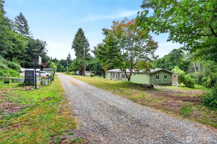Home on 2 tax parcels with chicken coop and room for parking on opposite side of road from house