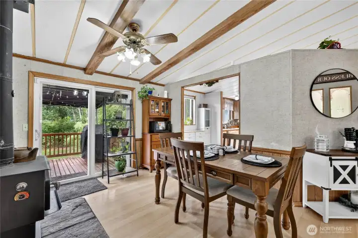 Formal Dining area with wood stove and connected to kitchen