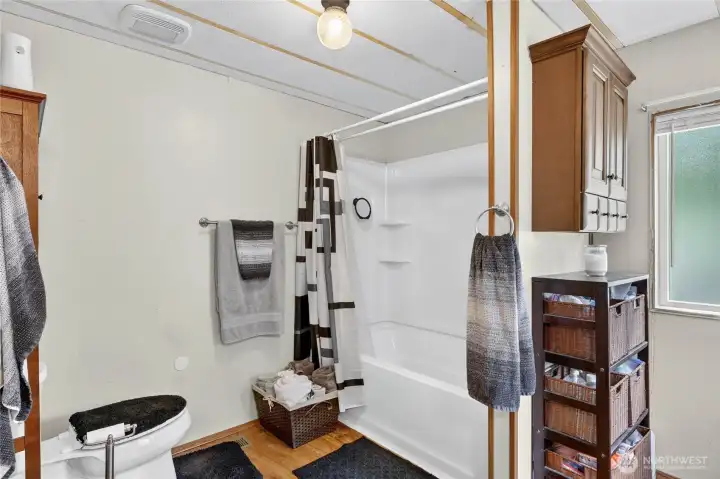 Primary en-suite Bath with tub, shower, vanity and lots of storage