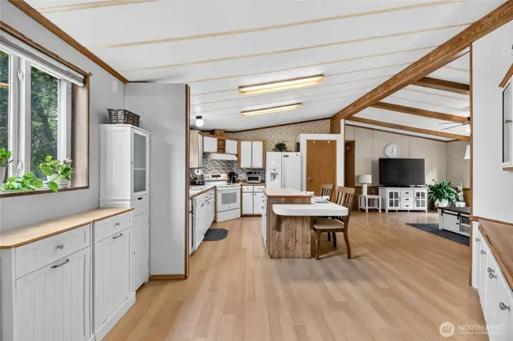 Vaulted Ceilings and open layout connecting kitchen, dining, living and family room