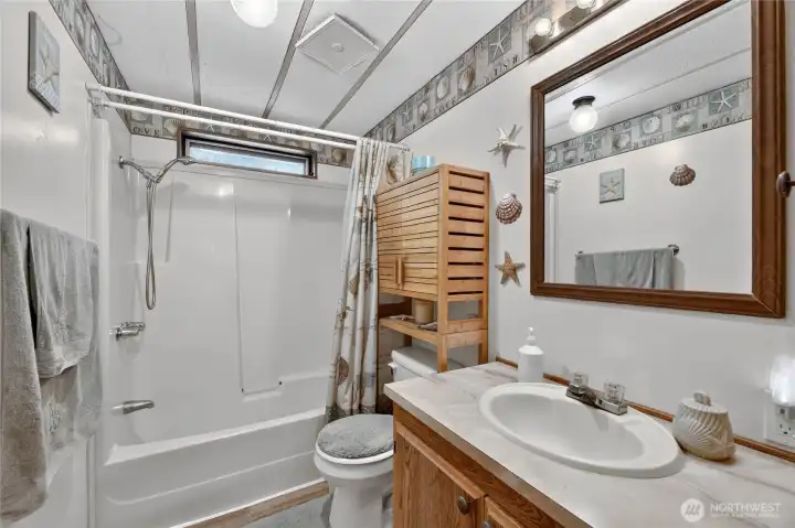 Large Full Main Bathroom with tub, shower and vanity