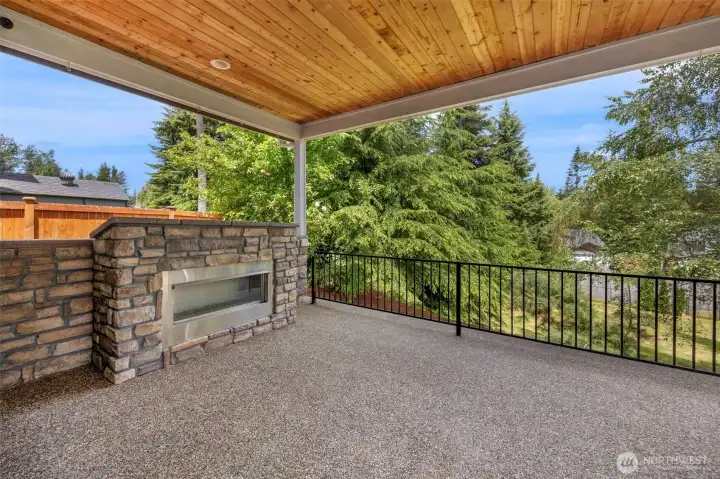 Private covered patio with gas fireplace