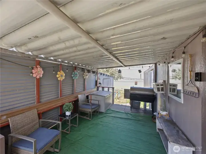 Covered porch with plenty of room for outdoor seating and year-round enjoyment. Covered porch with plenty of room for outdoor seating and year-round enjoyment.