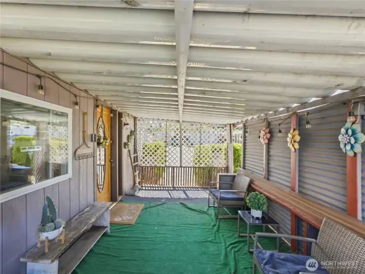 Covered porch with plenty of room for outdoor seating and year-round enjoyment. Covered porch with plenty of room for outdoor seating and year-round enjoyment.
