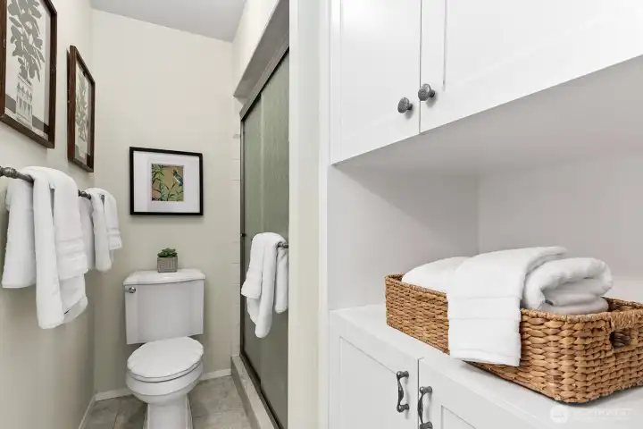 Private ensuite bath with ample storage