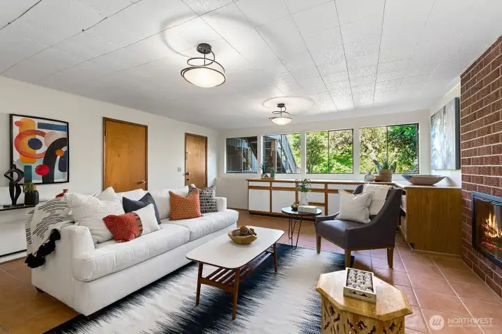 Spacious family room with fireplace and access to the backyard.