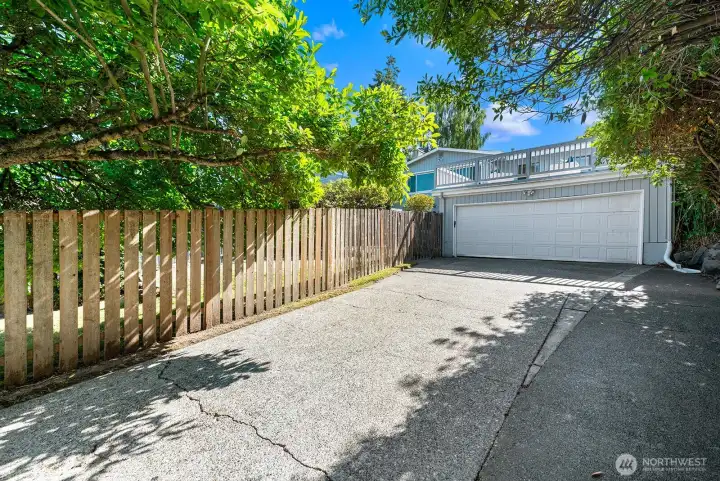 Wide driveway provides additional off-street parking for several vehicles.