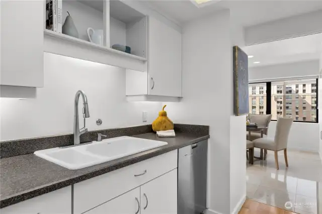 Open shelving on the sink side of the kitchen.