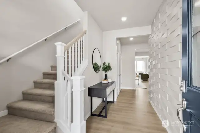 Bright & open grand entry featuring 9’ main floor ceilings and 8’ upper floor ceilings. Photos from another community, finishes and colors vary. All photos are for “Representational Purposes Only"