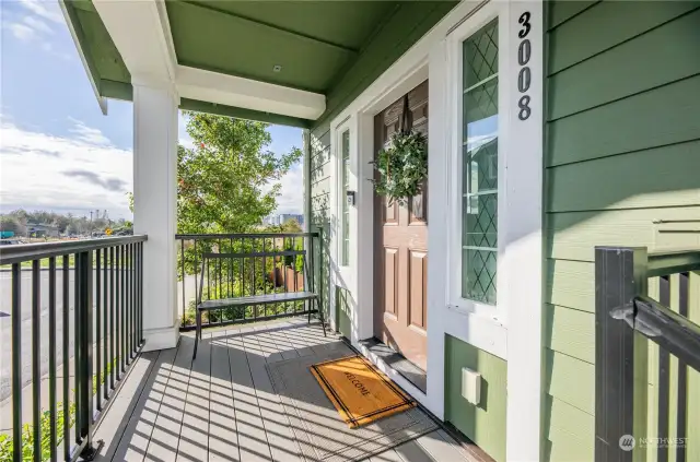 Covered front porch with composite deck faces East