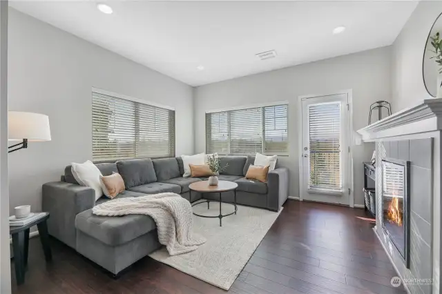 Living room with door to balcony overlooking your yard, open space and peek-a-boo river view!