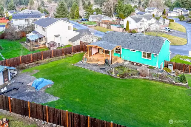 Covered deck, large outbuilding perfect for storage. New fence in 2023.