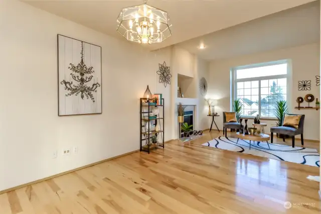 Dining room and living room with gas fireplace in the distance. Look at the cathedral ceilings.