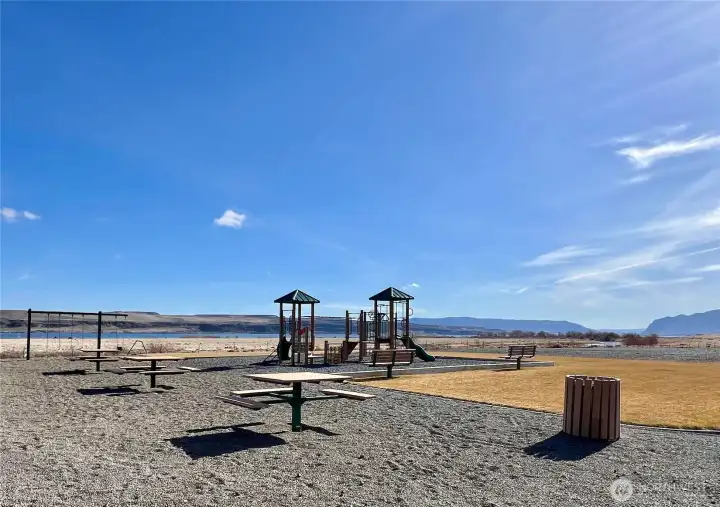Park area with picnic tables and play structure!