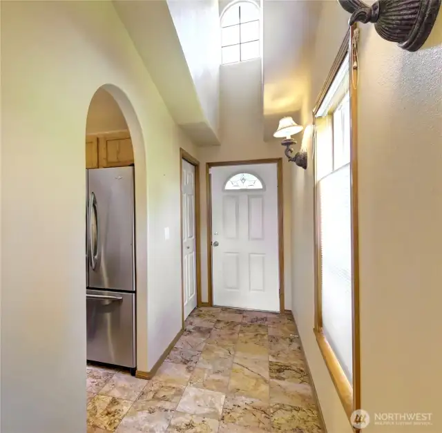 Entry with Closet and Vaulted Ceiling.