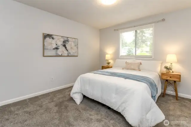 Extra bedroom with new carpet.