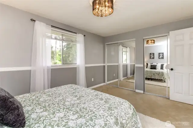 The window in the primary bedroom faces the backyard.