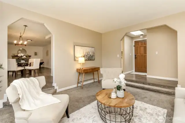 The living room has another entrance to the dining room and family room area.