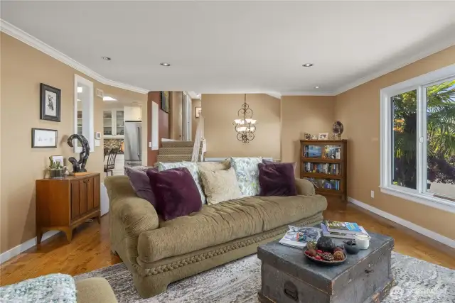 Back inside the home, looking towards the hallway and entry, a few steps will lead you to the 3 Bedrooms and Modernized Upper-level Bathrooms .