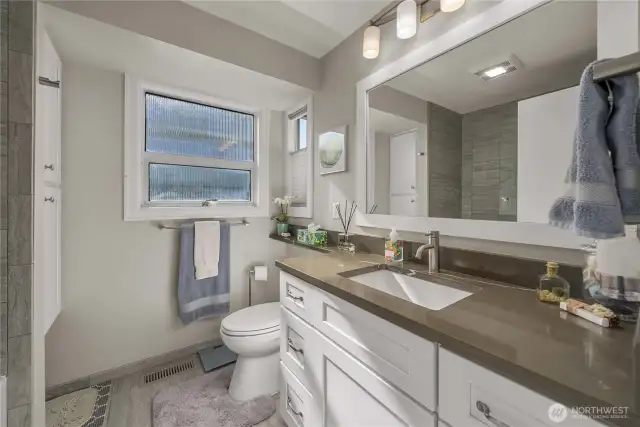 This Attractive Bathroom has been updated with Quartz and Modern Amenities; it’s so clean and fresh! Both Bathrooms on this level have been Stylishly Updated with Contemporary Fixtures and Finishes, adding a touch of Modern Comfort and Luxury to your daily routine.