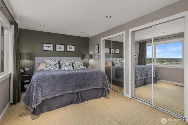You're going to be captivated by the Primary Bedroom Views; they are Incredible…definitely the Most Impressive Views in the Home!  Rise and Shine, Invigorated and Refreshed by this Breathtaking View! From this angle, you can see a small peek of the View through the mirrors. The Large Windows perfectly frame and maximize this Incredible View. The photos gives you a good idea, but they can't convey the feeling of actually being there. You really must see it in person!