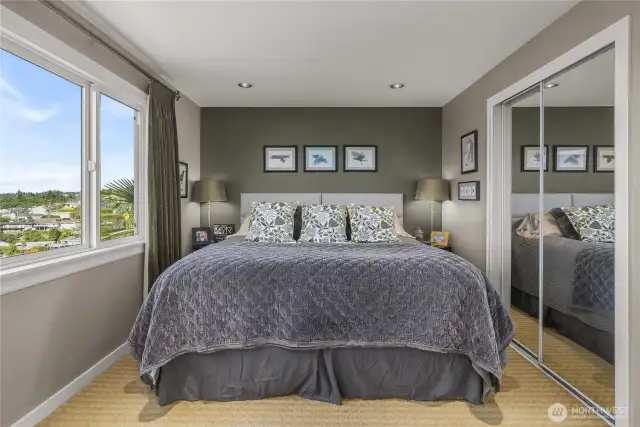You're going to be captivated by the Primary Bedroom Views; they are Incredible…definitely the Most Impressive Views in the Home!  The Soothing Earth Tones and Luxurious, Blackout Window Treatments create a Peaceful Environment and promote a Good Night’s Rest. Then, feel refreshed and invigorated by waking up to that Breathtaking View!