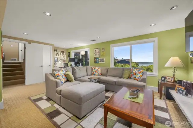 Another View of this spacious Lower-Level. There is an Extra-Finished room to the left of this photo that can be used for crafts, a den, playroom, more storage, a possible 4th bedroom, a small murphy bed for guests, or whatever meets your needs.