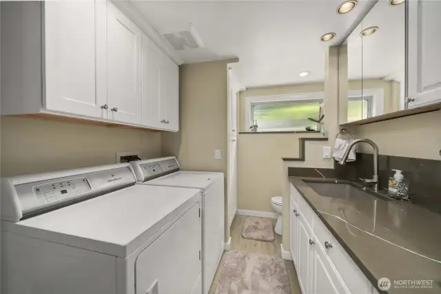 The Laundry/Utility is also fully updated with Quartz, Lots of Storage Cabinets and a Utility Sink! The Shower was taken out, but the plumbing is still intact in case you desire another shower or other changes.