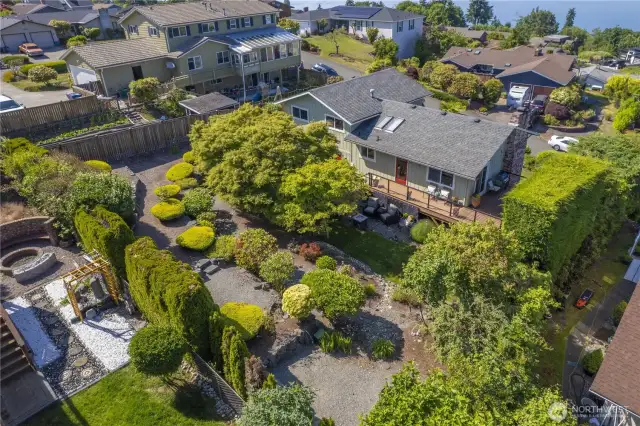 Ariel view of the back yard. The overall impression is one of peace and harmony, a serene oasis within a suburban landscape.