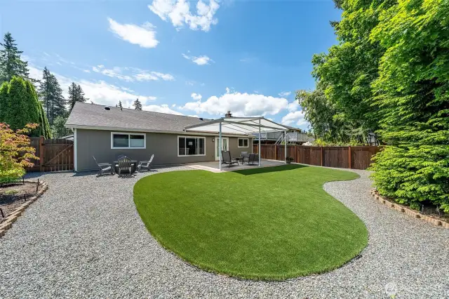 Enjoy year-round outdoor living with low-maintenance artificial turf and a thoughtfully designed outdoor space, it's the perfect setting for both everyday relaxation and effortless entertaining.