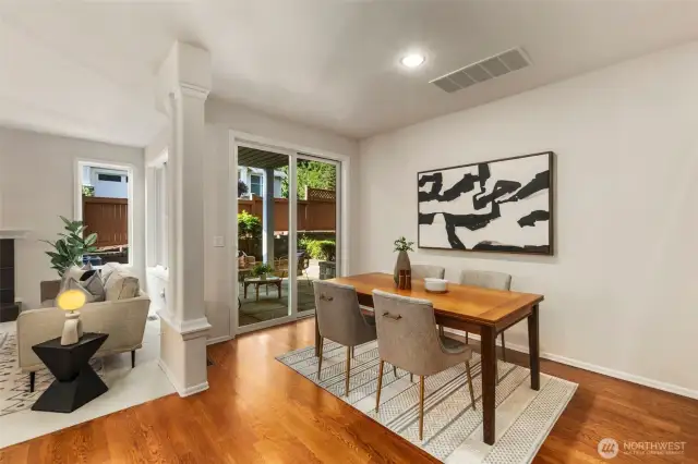 The dining area sits just off the living room and kitchen and opens to the backyard covered patio, creating a seamless indoor-outdoor flow. With recessed lighting above and natural light pouring in through the sliding glass doors, the space feels open, connected, and ready for gatherings.
