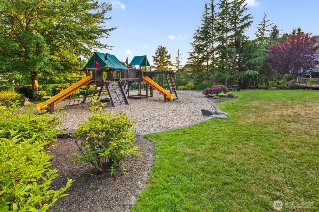 Just across the cul-de-sac, a charming pocket park invites play and relaxation with its colorful playground, winding cement path, open lawn, picnic table, and mature trees—perfect for little ones, walking the dog, or enjoying a quiet picnic beneath the trees. A short walk away is another park, Woodlands park, with a walking trail entrance a short way west on NE 116th St and north on 171st Pl NE on the right side of the street, just a couple blocks away.