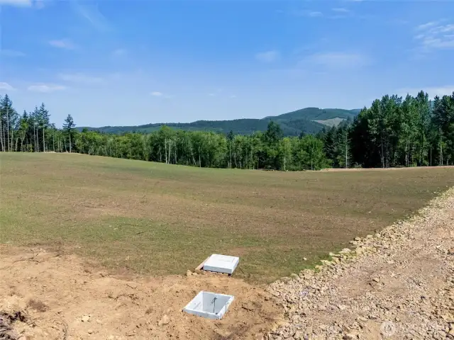 Looking Northwest. Electrical Vault in foreground.