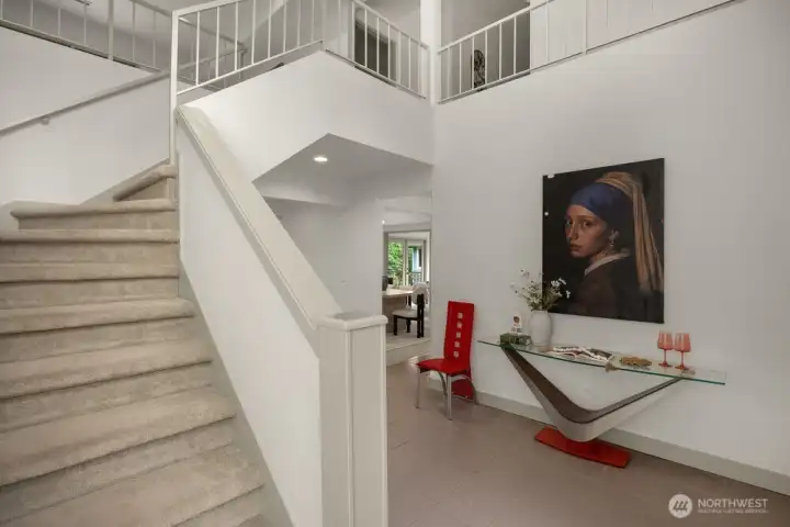 Dramatic stairway in front foyer