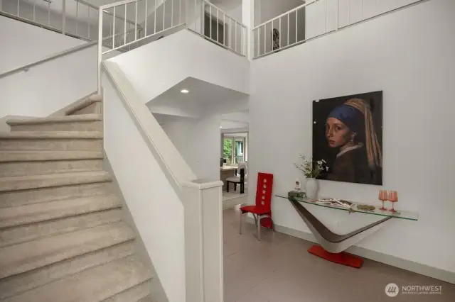 Dramatic stairway in front foyer