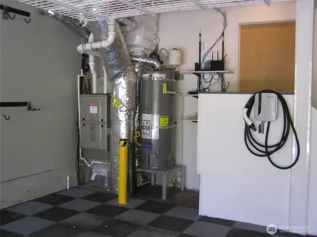 Gas heat and hot water are in garage. Car charger is ready to start charging.