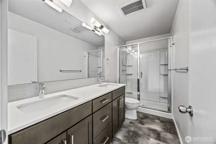 third floor primary bathroom with large shower
