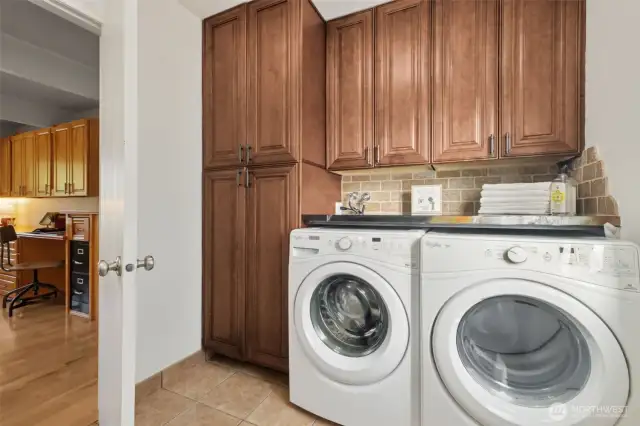 Roomy and includes lots of cabinets PLUS the washer & dryer stay!
