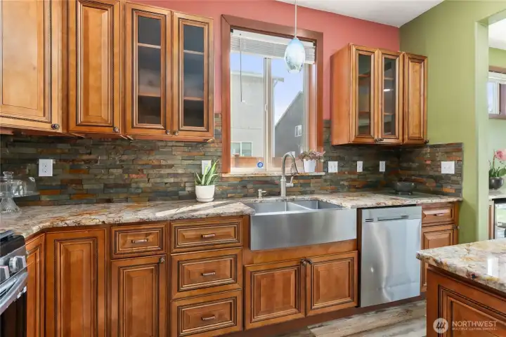 Stainless steel appliances, gas stove and farmhouse sink