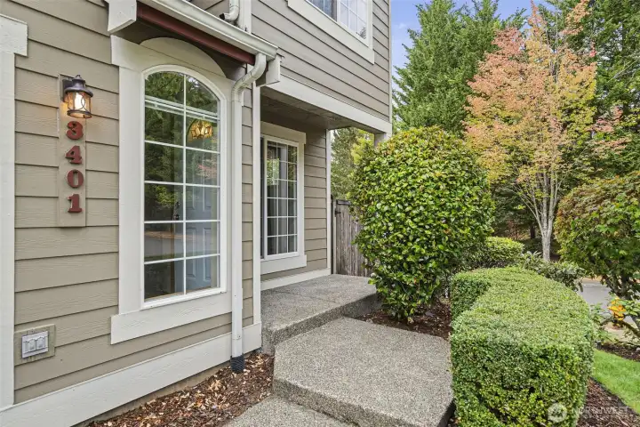Mature landscaping accents the entry to home, HOA maintenance the front yard too!