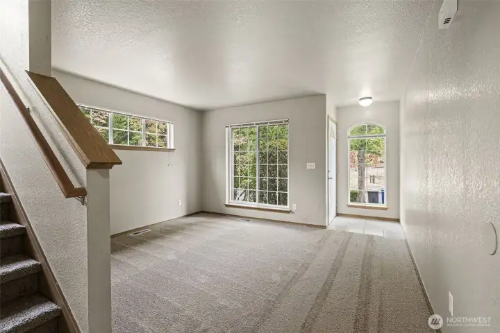 Large windows allow for ample natural light in living room.