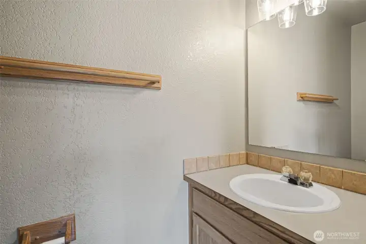 Half bathroom off family room, perfect for guests