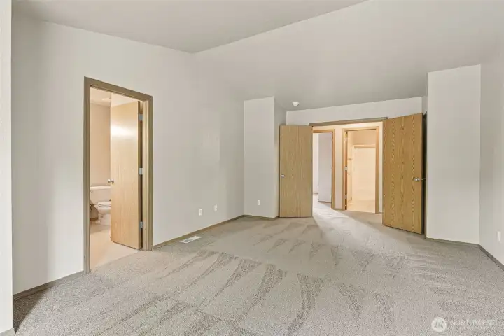 French doors open to oversized primary bedroom on the second floor